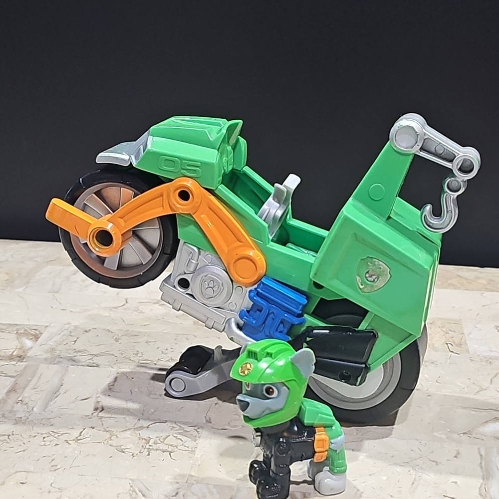 Paw Patrol Moto Pups Rocky’s Deluxe Pull Back Motorcycle‎ Vehicle with Wheelie